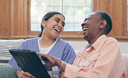 carer laughing with a patient